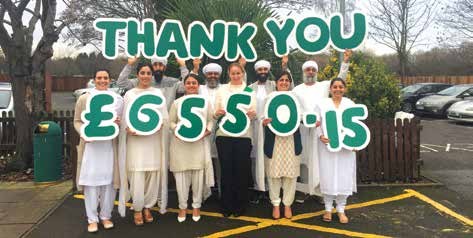 Sangat members holding up letters reading Thank you £6550.15
